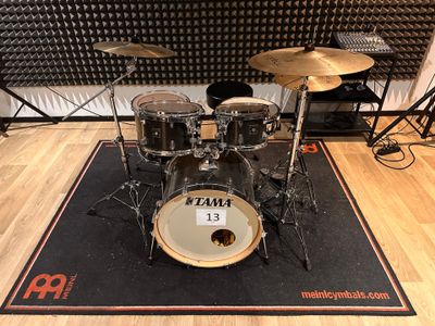 the drum kit is ready to be used in the recording room