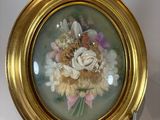 a picture of a picture of flowers in a gold frame