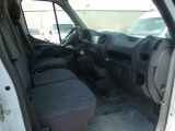 a white van with a black seat and a black seat cover