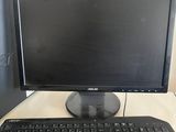 a desktop computer sitting on a desk with a keyboard and mouse