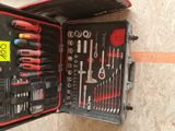 a tool case with tools in it sitting on the floor