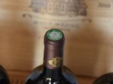 three bottles of wine that are sitting on a table