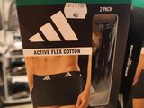 boxes of adidas active flex cotton underwear on display in a store