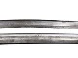 two knives that are laying side by side on a white surface