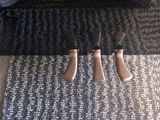 two pairs of shoes that are sitting on a carpet