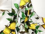 a dress with lemons on it on a mannequin