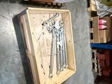 a wooden box with a bunch of tools in it