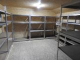 a room with a lot of shelves and shelves in it