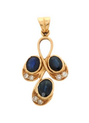 an 18k gold pendant with sapphire and diamonds