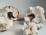 two pieces of rock that are sitting on a table