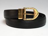a close up of a black belt with a gold buckle