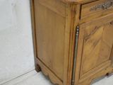 a small wooden cabinet with a drawer on it