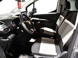the interior of a small car with a black and white seat cover