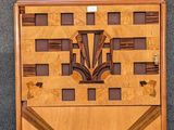 two pieces of art nouveaul wood with geometric designs on them