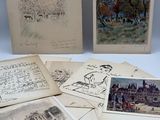 un assortiment de vieux livres et de dessins posés sur une surface blanche