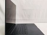 an open laptop computer sitting on top of a white surface