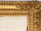 an image of a gold frame on a wall with a white background