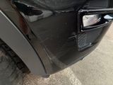 a close up of a car ' s front bumper