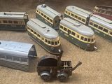 several toy trains are lined up on the floor next to each other