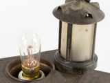 a small light that is sitting on top of a piece of metal