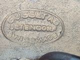 a close up of a metal object on a sidewalk