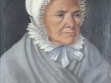 portrait d'une vieille femme portant un bonnet et une robe bleue