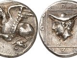 a close up of a silver coin with a horse on it