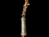 a wooden stick with a metal handle on a black background