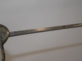 a metal object with a handle that is attached to it