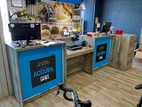a bike parked in front of a desk in a room