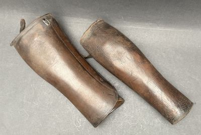 two pairs of boots that are sitting on a table