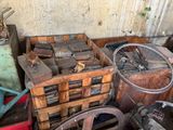 a pile of junk in a room with a bicycle wheel