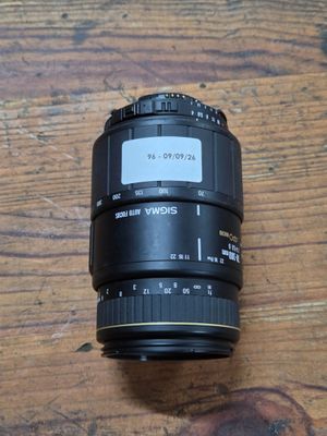 a camera lens sitting on a wooden table