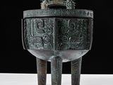 a large metal bowl with a design on it