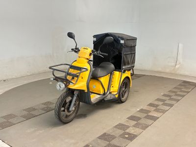 a small yellow motorcycle with a black seat in a garage