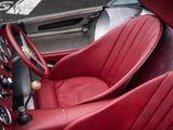 a close up of a red leather seat in a car