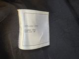 a black jacket with a white label on it