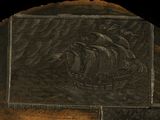 a picture of a picture of a ship carved into a rock