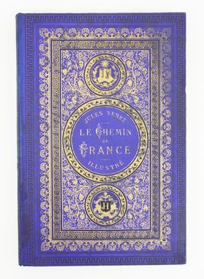 un livre bleu avec des bordures dorées et une couverture bleue