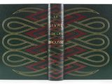 an open book with a red and green cover on it