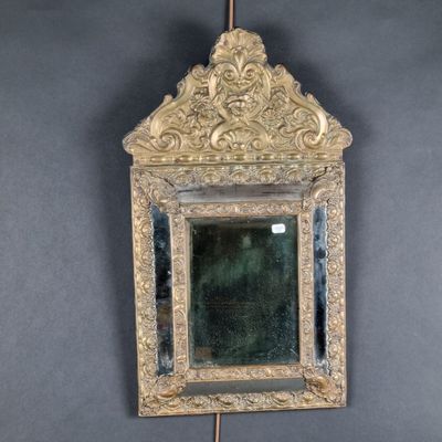 a mirror hanging on the wall in the room