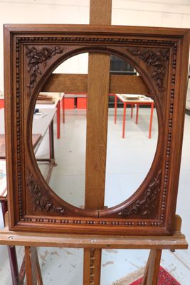 a mirror that is on a stand in a room