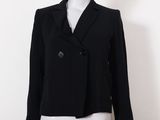 a mannequin mannequin wearing a black jacket and white skirt