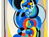 une image représentant un tableau sur fond blanc, avec des cercles bleus, jaunes, rouges et verts