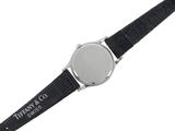 the watch is black with a silver face and a black strap