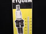 une image représentant un panneau jaune et noir sur lequel figure un thermomètre