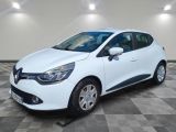 a white car is parked in a room with a checkered floor