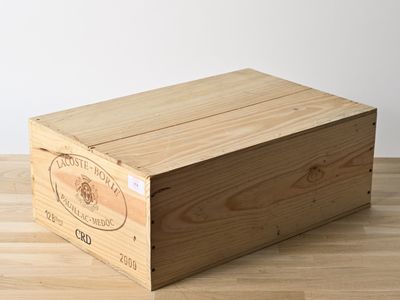 a wooden box that is sitting on a wooden floor