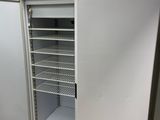 a refrigerator that is open in a kitchen