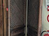 two wooden doors that are open in a room